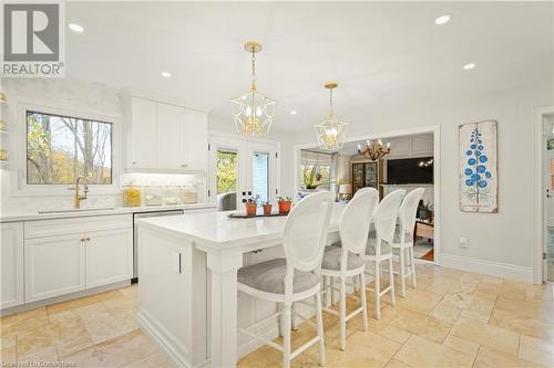 Kitchen featuring a center island, plenty of natural light, white cabinets, and sink - 659 Deervalley Road, Ancaster, ON - Indoor