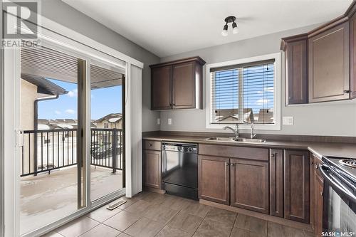 34 4640 Harbour Landing Drive, Regina, SK - Indoor Photo Showing Kitchen With Double Sink