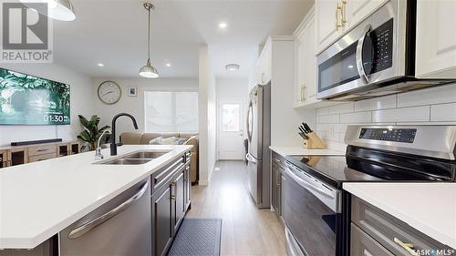 5438 Primrose Green Drive E, Regina, SK - Indoor Photo Showing Kitchen With Double Sink