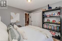 Bedroom featuring hardwood / wood-style floors and a closet - 