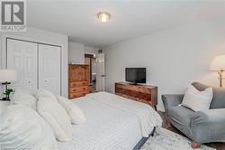 Bedroom featuring hardwood / wood-style floors and a closet - 