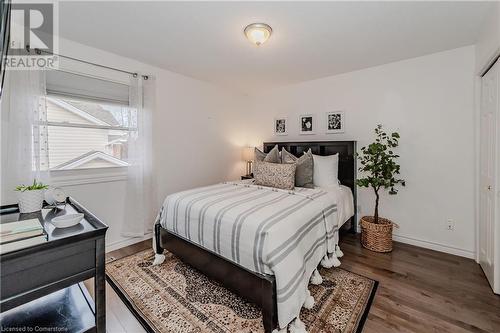 Bedroom with hardwood / wood-style flooring and a closet - 17 Weir Drive, Guelph, ON - Indoor Photo Showing Bedroom