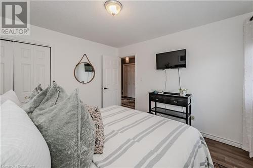 Bedroom with dark hardwood / wood-style floors and a closet - 17 Weir Drive, Guelph, ON - Indoor Photo Showing Bedroom