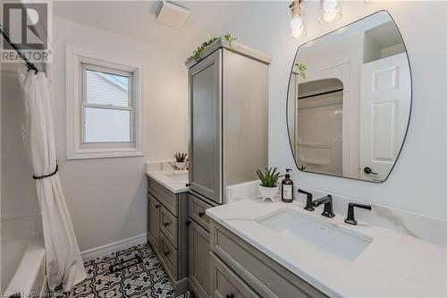 Bathroom featuring tile patterned flooring, vanity, and shower / tub combo with curtain - 17 Weir Drive, Guelph, ON - Indoor Photo Showing Bathroom