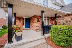 View of exterior entry with covered porch - 