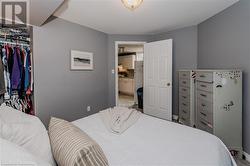 Carpeted bedroom featuring a closet - 