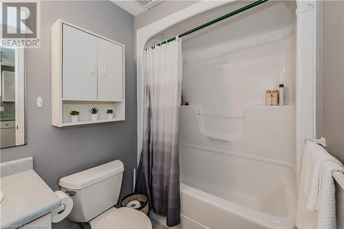 Full bathroom with shower / bathtub combination with curtain, vanity, and toilet - 17 Weir Drive, Guelph, ON - Indoor Photo Showing Bathroom