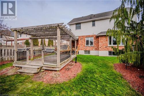 Rear view of house featuring a deck, a pergola, and a yard - 17 Weir Drive, Guelph, ON - Outdoor