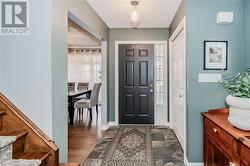 Foyer with dark hardwood / wood-style flooring - 