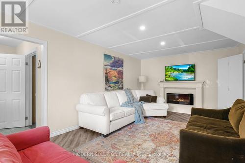 23 Elizabeth Avenue, Tiny, ON - Indoor Photo Showing Living Room With Fireplace