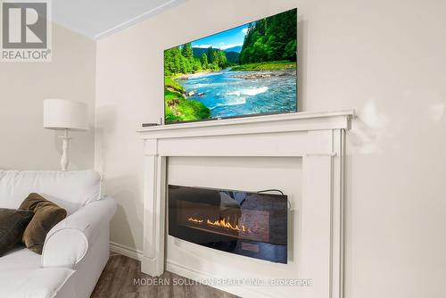 23 Elizabeth Avenue, Tiny, ON - Indoor Photo Showing Living Room With Fireplace