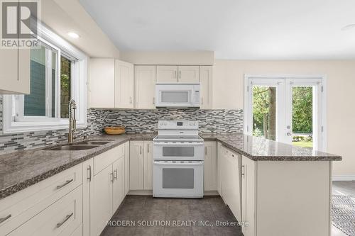 23 Elizabeth Avenue, Tiny, ON - Indoor Photo Showing Kitchen With Double Sink With Upgraded Kitchen