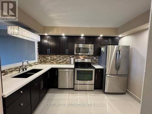 503 - 24 Hanover Road, Brampton, ON - Indoor Photo Showing Kitchen With Double Sink