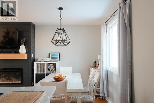 581 Saugeen Crescent, Peterborough (Ashburnham), ON - Indoor Photo Showing Dining Room With Fireplace