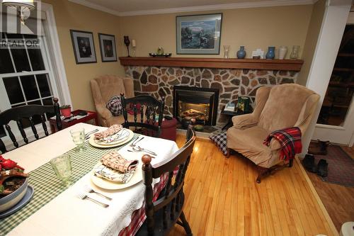 16 Domans Lane, Corner Brook, NL - Indoor Photo Showing Dining Room With Fireplace