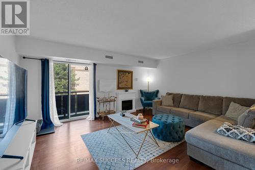 205B - 211 Forum Drive, Mississauga, ON - Indoor Photo Showing Living Room With Fireplace