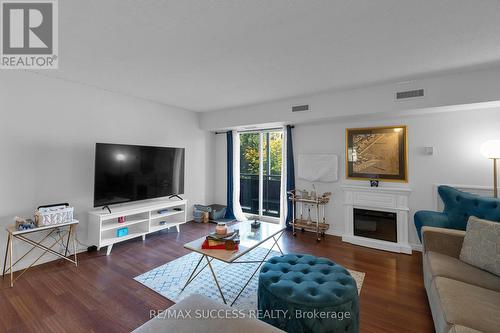 205B - 211 Forum Drive, Mississauga, ON - Indoor Photo Showing Living Room With Fireplace