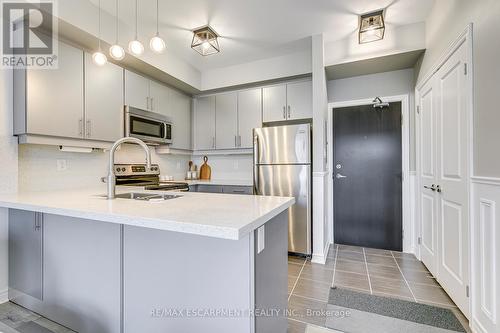 310 - 269 Georgian Drive, Oakville, ON - Indoor Photo Showing Kitchen With Stainless Steel Kitchen With Double Sink