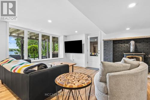 80 Neville Point Road, Stone Mills, ON - Indoor Photo Showing Living Room With Fireplace