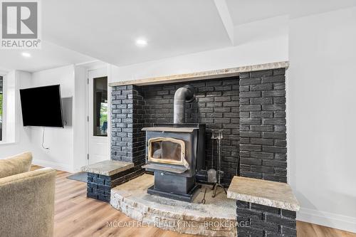 80 Neville Point Road, Stone Mills, ON - Indoor Photo Showing Living Room With Fireplace