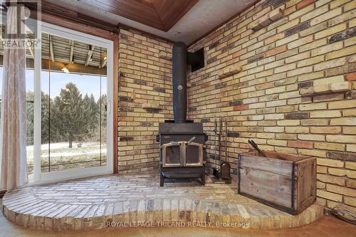 9580 Sinclair Drive, Middlesex Centre, ON - Indoor Photo Showing Other Room With Fireplace