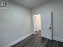 Spare room featuring dark hardwood / wood-style floors - 660 Main Street E Unit# 1, Hamilton, ON  - Indoor Photo Showing Other Room 