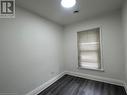 Spare room featuring dark hardwood / wood-style floors - 660 Main Street E Unit# 1, Hamilton, ON  - Indoor Photo Showing Other Room 