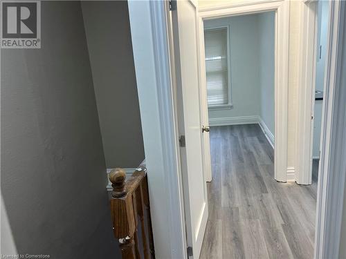 Hallway featuring light hardwood / wood-style floors - 660 Main Street E Unit# 1, Hamilton, ON - Indoor Photo Showing Other Room