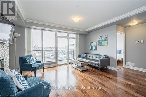 901 - 150 Wellington Street E, Guelph (Central West), ON - Indoor Photo Showing Living Room With Fireplace