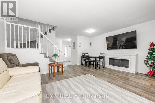 7 Foxden Place, Ottawa, ON - Indoor Photo Showing Living Room With Fireplace