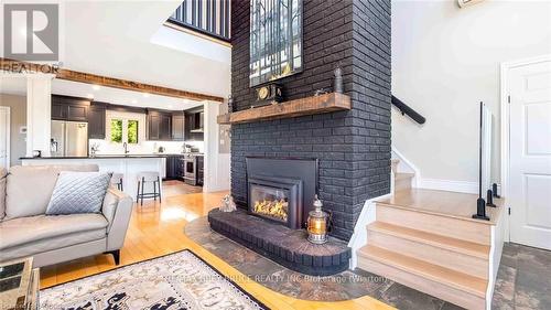 151 Grandore Street W, Georgian Bluffs, ON - Indoor Photo Showing Living Room With Fireplace