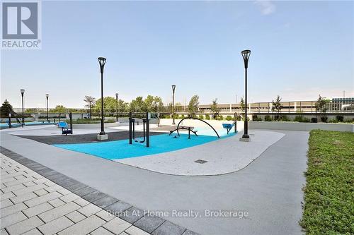 305 - 2093 Fairview Street, Burlington (Freeman), ON - Outdoor With In Ground Pool