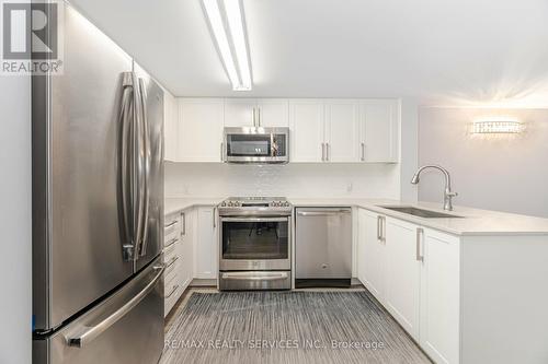 318 - 30 Via Rosedale, Brampton, ON - Indoor Photo Showing Kitchen With Stainless Steel Kitchen With Upgraded Kitchen