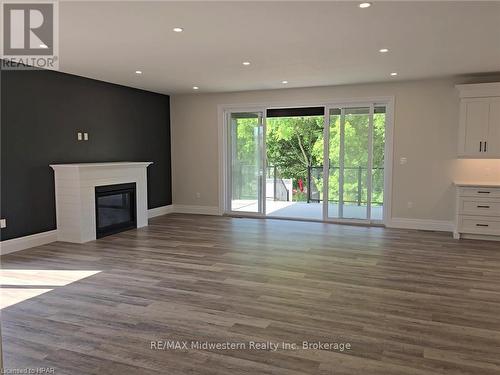 475 Keeso Lane, North Perth (Listowel), ON - Indoor Photo Showing Other Room With Fireplace