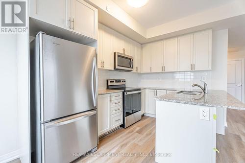 123 - 1577 Rose Way, Milton, ON - Indoor Photo Showing Kitchen With Upgraded Kitchen