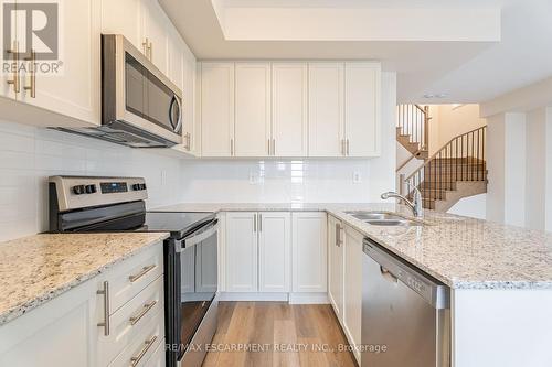 123 - 1577 Rose Way, Milton, ON - Indoor Photo Showing Kitchen With Double Sink With Upgraded Kitchen