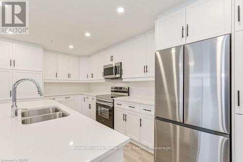 302 - 99B Farley Road, Centre Wellington (Fergus), ON - Indoor Photo Showing Kitchen With Stainless Steel Kitchen With Double Sink With Upgraded Kitchen