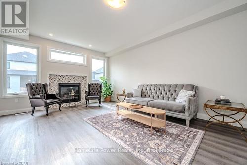 45 Queensgate Crescent, Woolwich, ON - Indoor Photo Showing Living Room With Fireplace