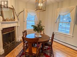 Dining space with baseboard heating and hardwood / wood-style floors - 