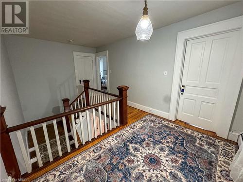 Staircase with hardwood / wood-style flooring - 166 North Street, Fort Erie, ON - Indoor Photo Showing Other Room