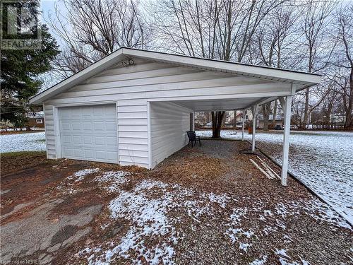 Snow covered garage with a carport - 166 North Street, Fort Erie, ON - Outdoor