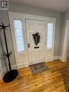 Foyer featuring light wood-type flooring - 