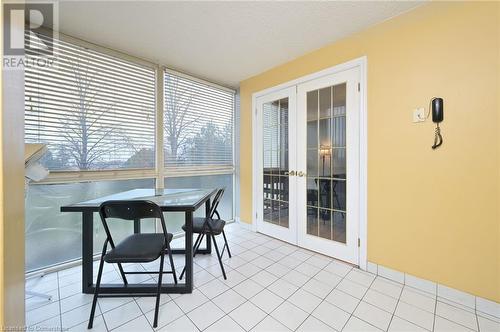 Sunroom / solarium featuring french doors - 305 Webb Drive Unit# 308, Mississauga, ON 