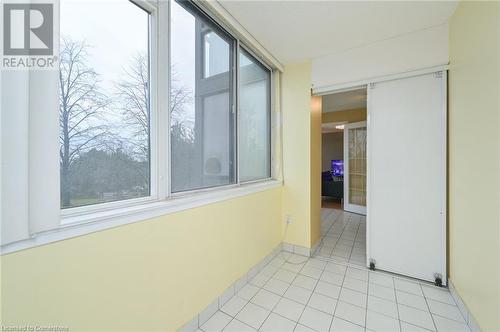 Hallway featuring light tile patterned flooring - 305 Webb Drive Unit# 308, Mississauga, ON 