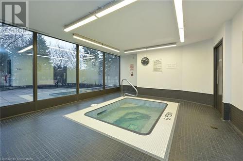 View of pool with an indoor hot tub - 305 Webb Drive Unit# 308, Mississauga, ON 