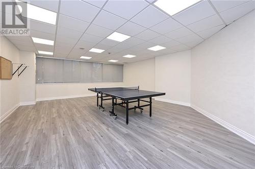 Recreation room with a paneled ceiling and light wood-type flooring - 305 Webb Drive Unit# 308, Mississauga, ON 