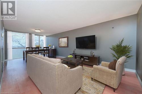 Living room featuring wood-type flooring - 305 Webb Drive Unit# 308, Mississauga, ON 