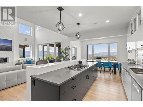 750 Kuipers Crescent, Kelowna, BC - Indoor Photo Showing Kitchen With Fireplace With Double Sink