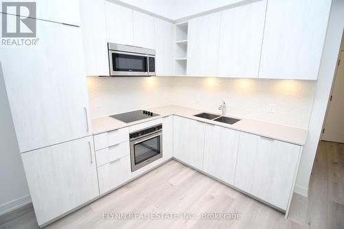 323 - 50 Ordnance Street, Toronto, ON - Indoor Photo Showing Kitchen With Double Sink