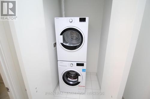 323 - 50 Ordnance Street, Toronto, ON - Indoor Photo Showing Laundry Room